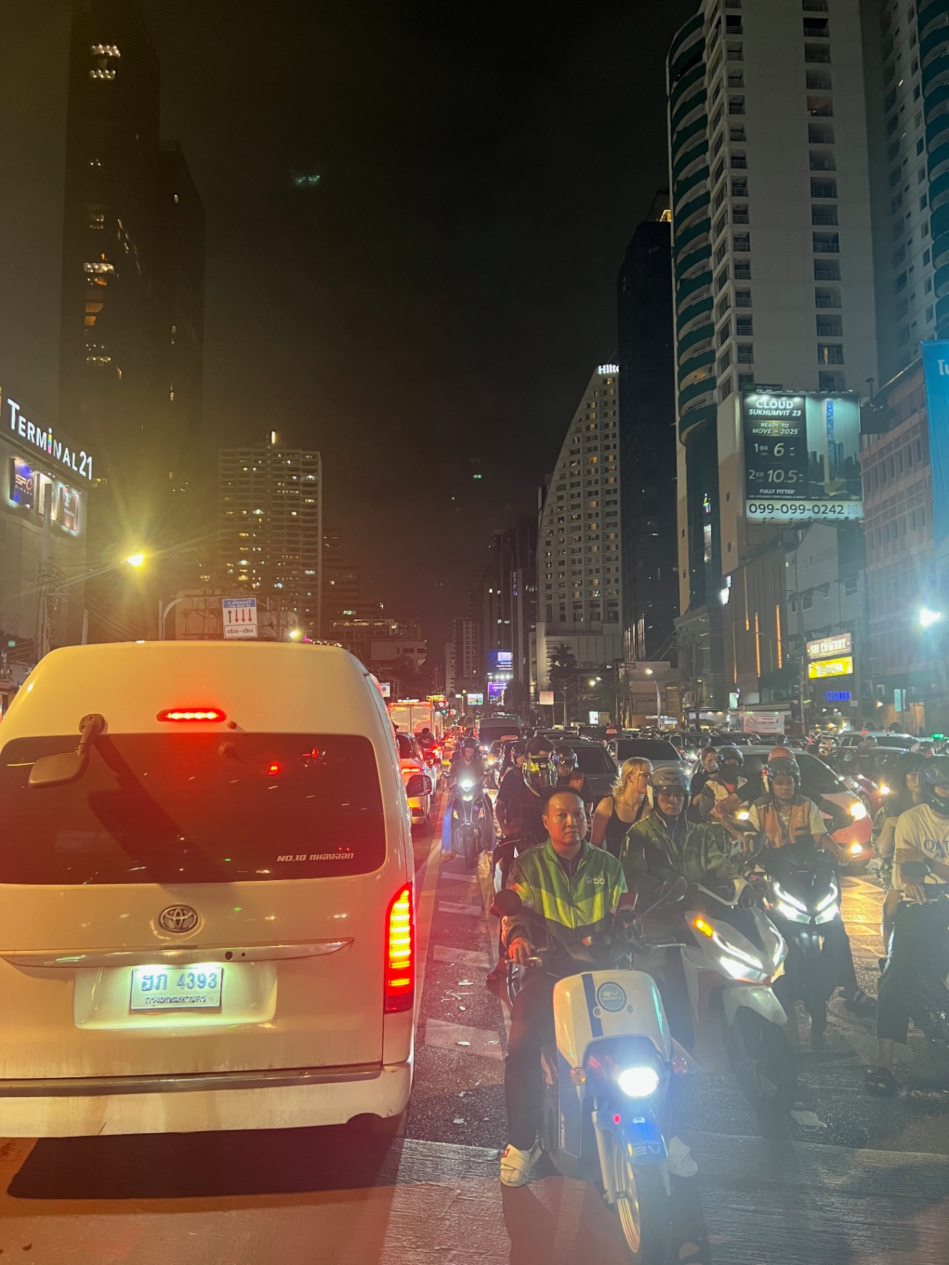Bangkok — Sukhumvit gridlock and motorbikes weaving past Terminal 21.