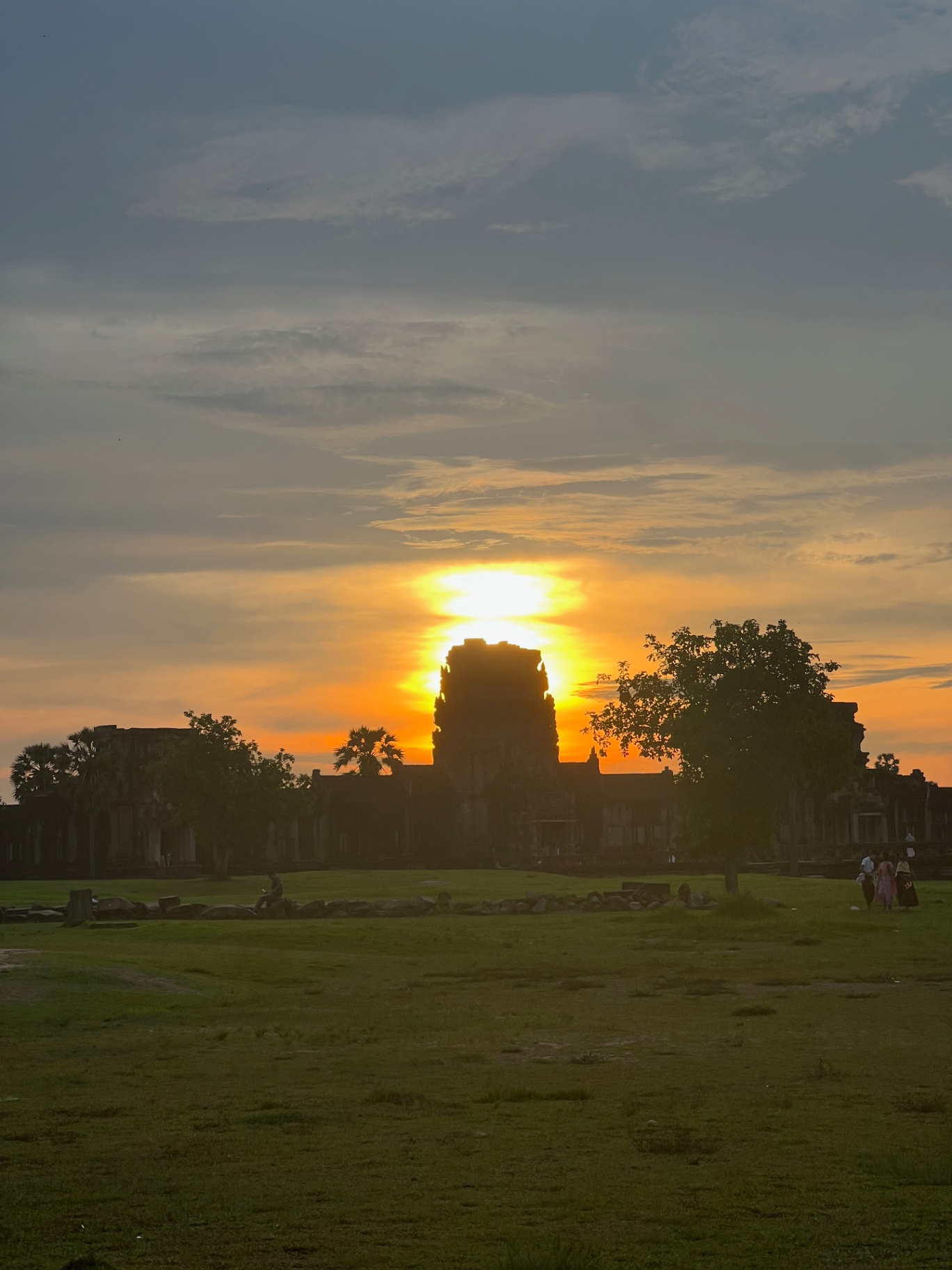 Siem Reap — Sun rising directly behind a temple spire.