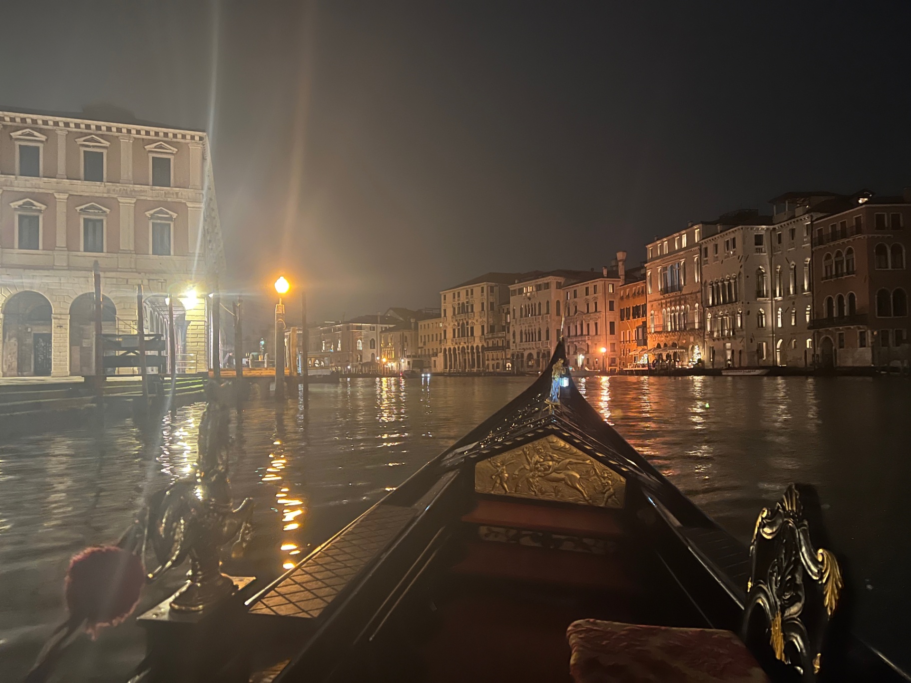 Venice — Gondola ride down the Grand Canal at night.