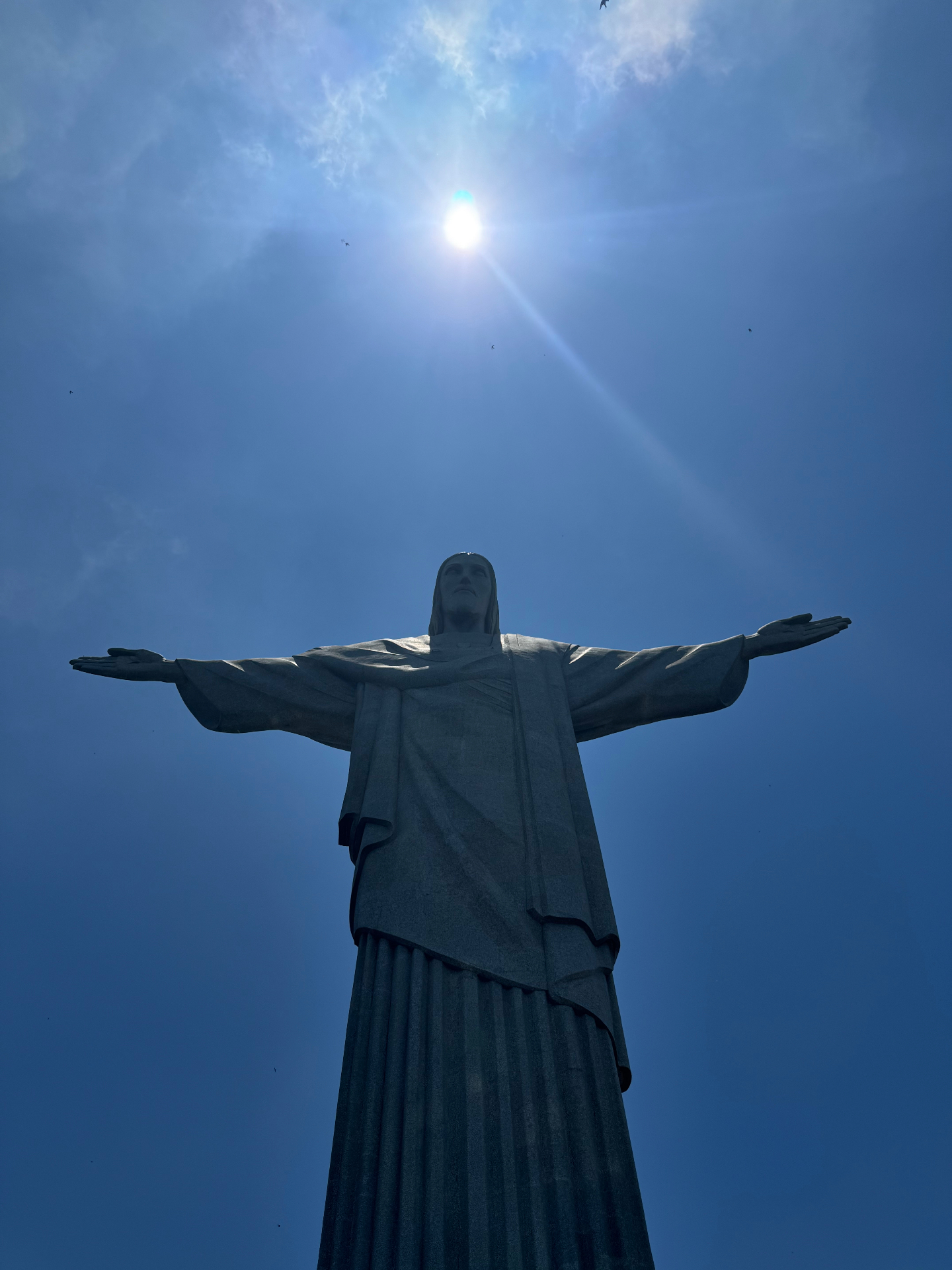 Rio de Janeiro — Cristo Redentor silhouetted against the midday sun.