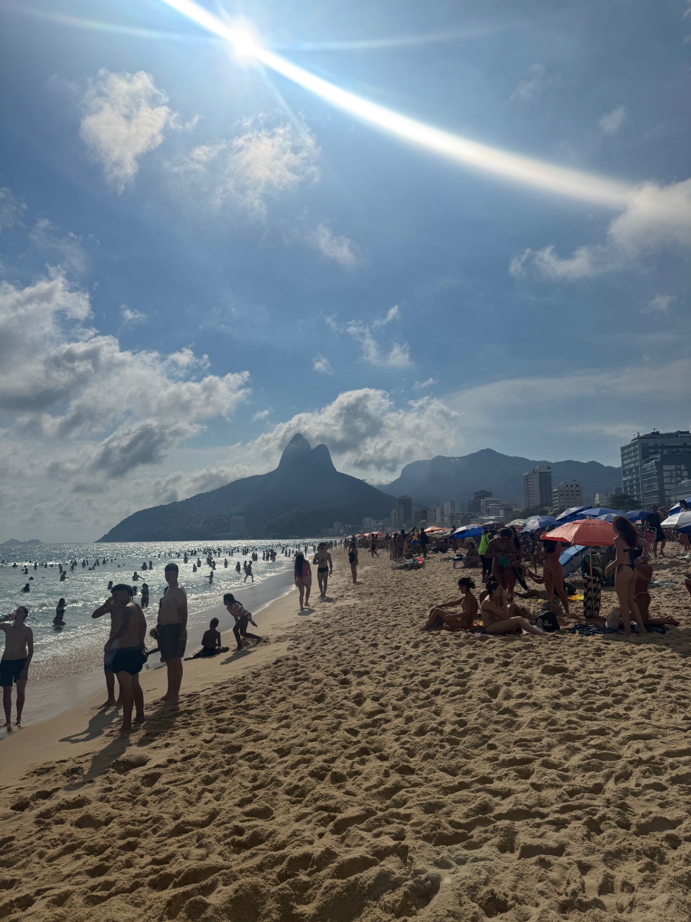 Rio de Janeiro — Ipanema beach with Dois Irmãos rising through the haze.