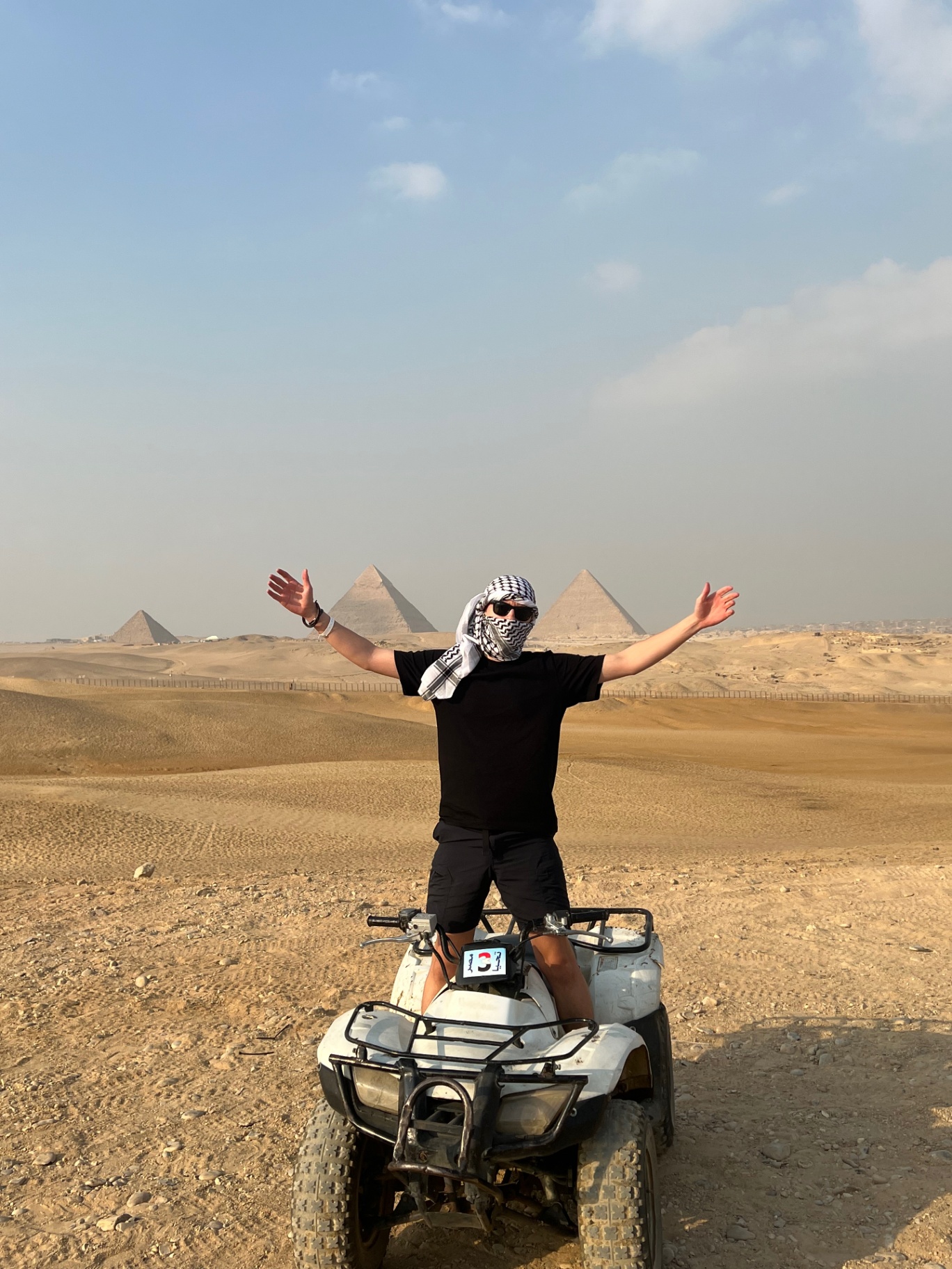 Cairo — Quad bike pause in front of all three pyramids.