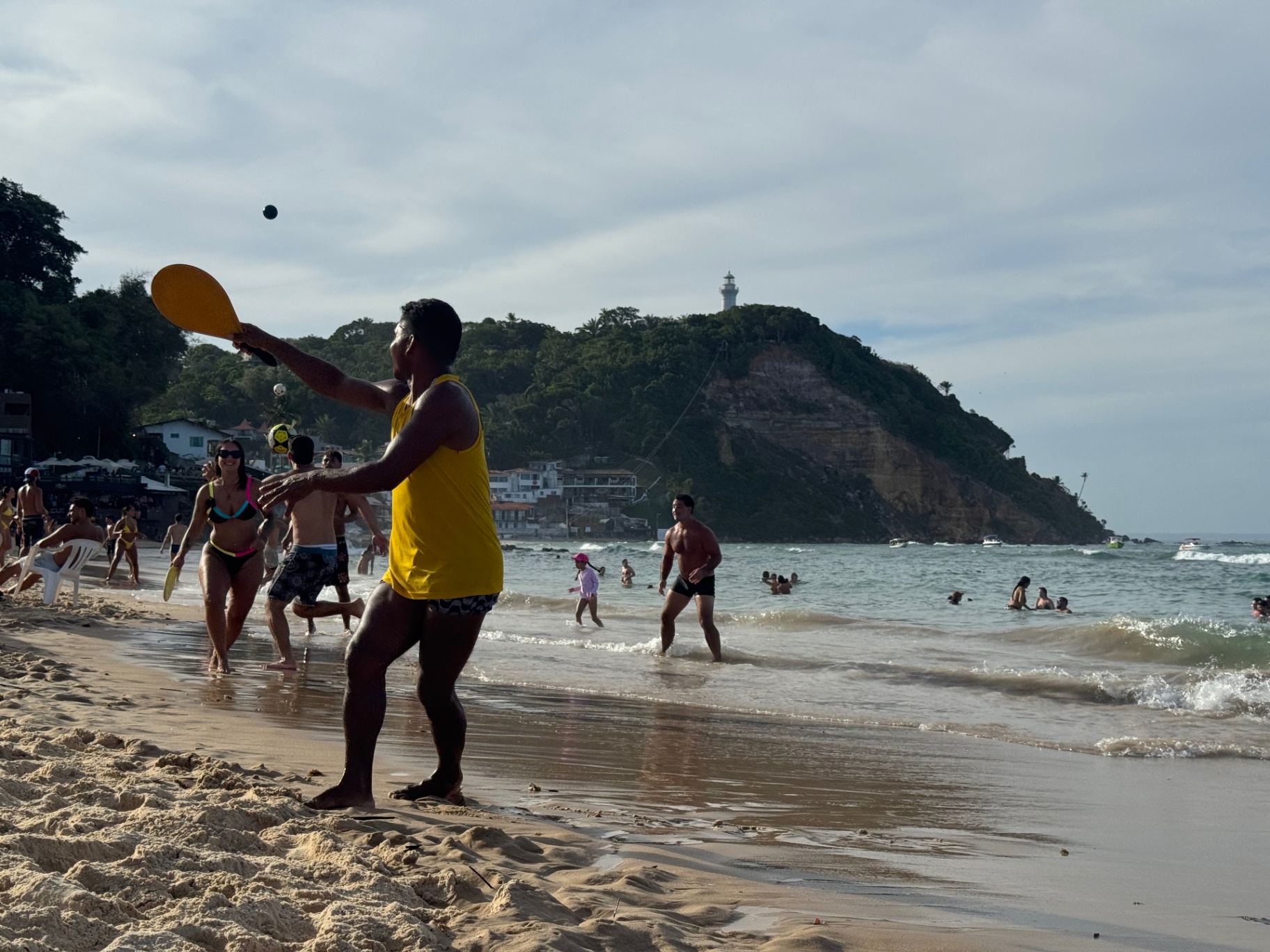 Morro de Sao Paulo — Frescobol on the sand below the lighthouse hill.