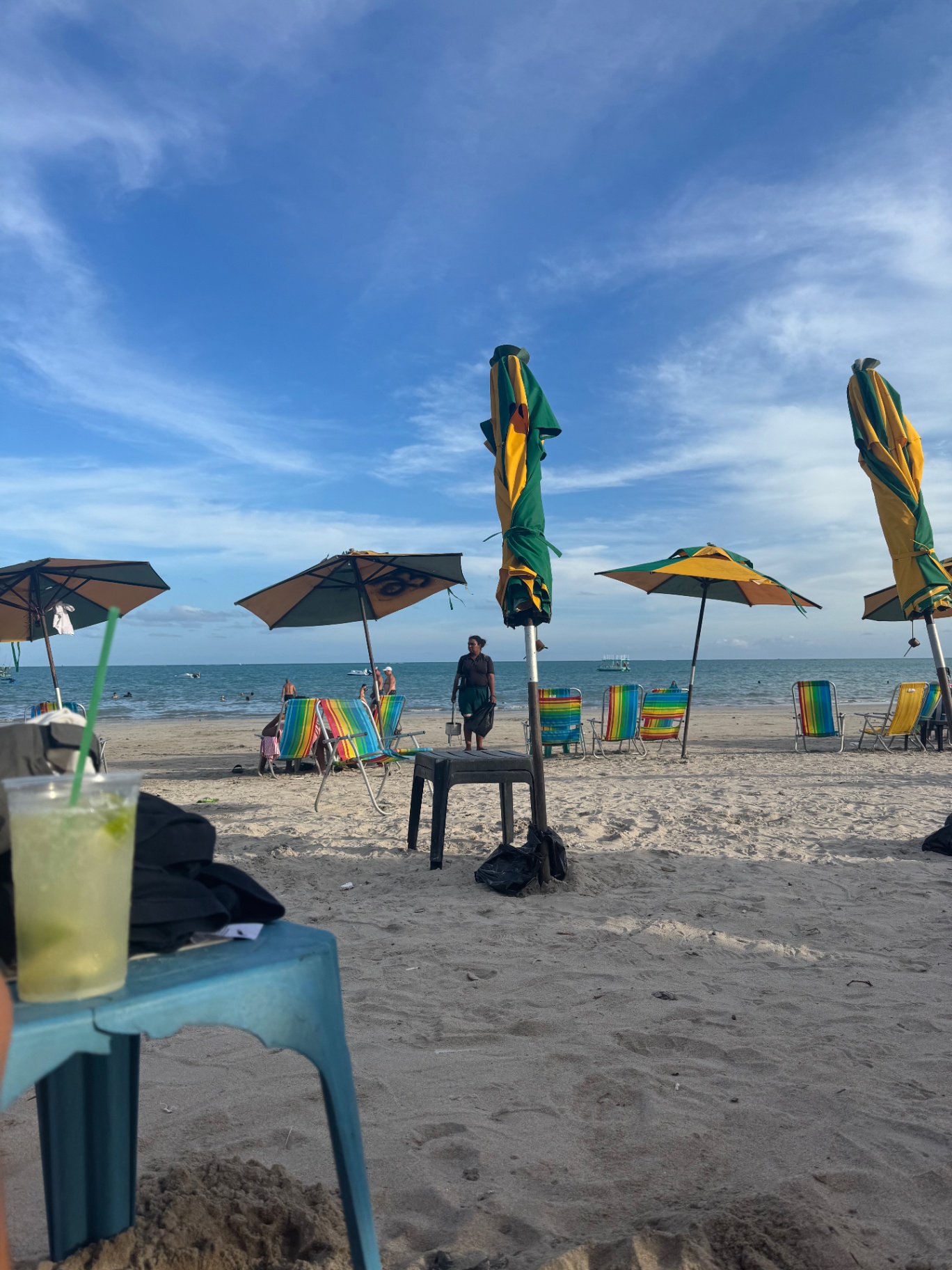 Maceio — Beach chairs and parasols facing the sea in late afternoon.