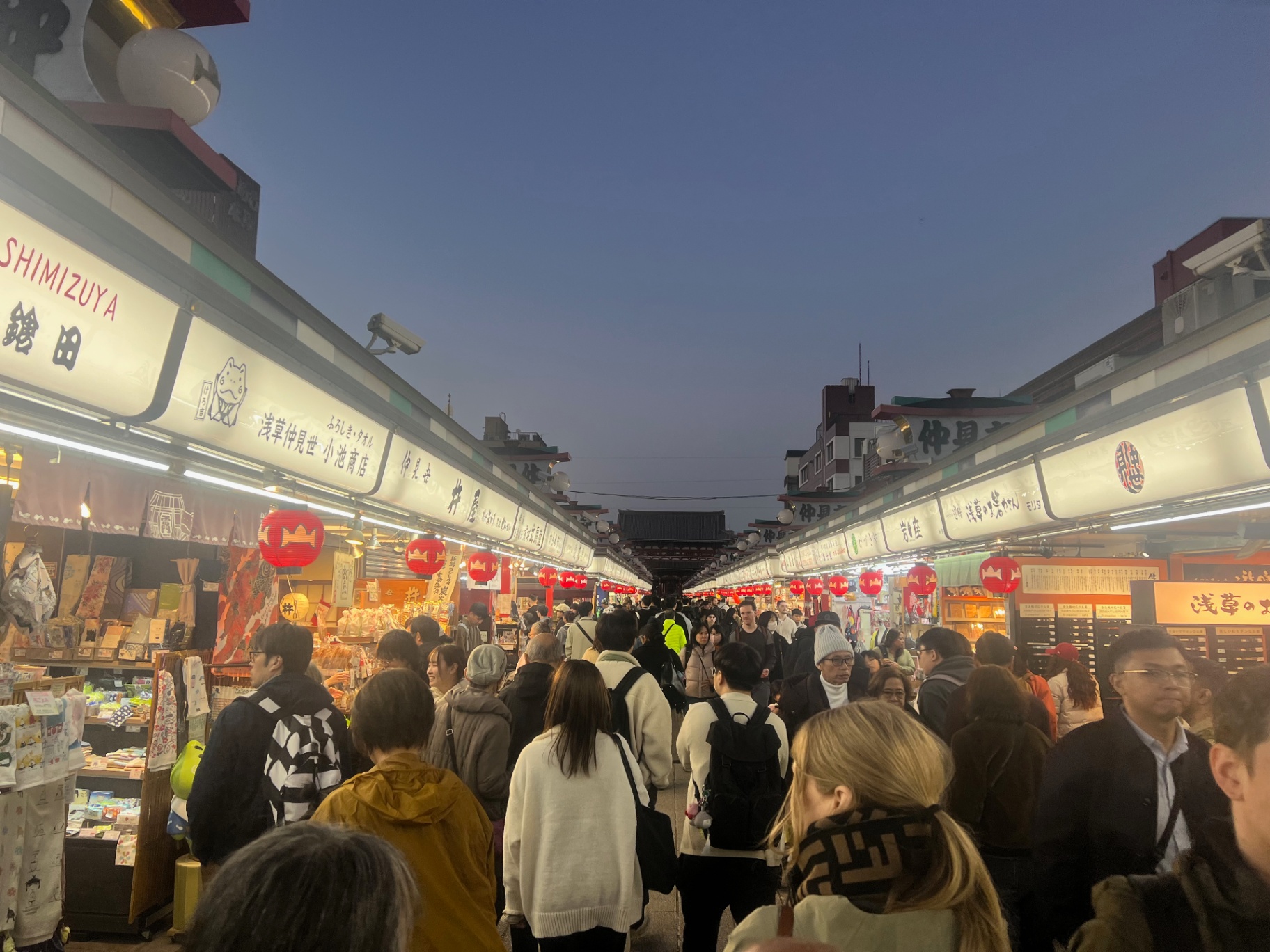 Tokyo — Nakamise-dori at blue hour — red lanterns and crowds running up to Senso-ji.