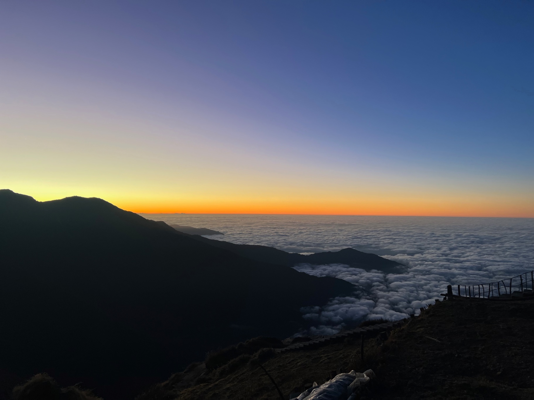 Pokhara — Sunrise above the clouds — pure gradient from orange to deep blue.