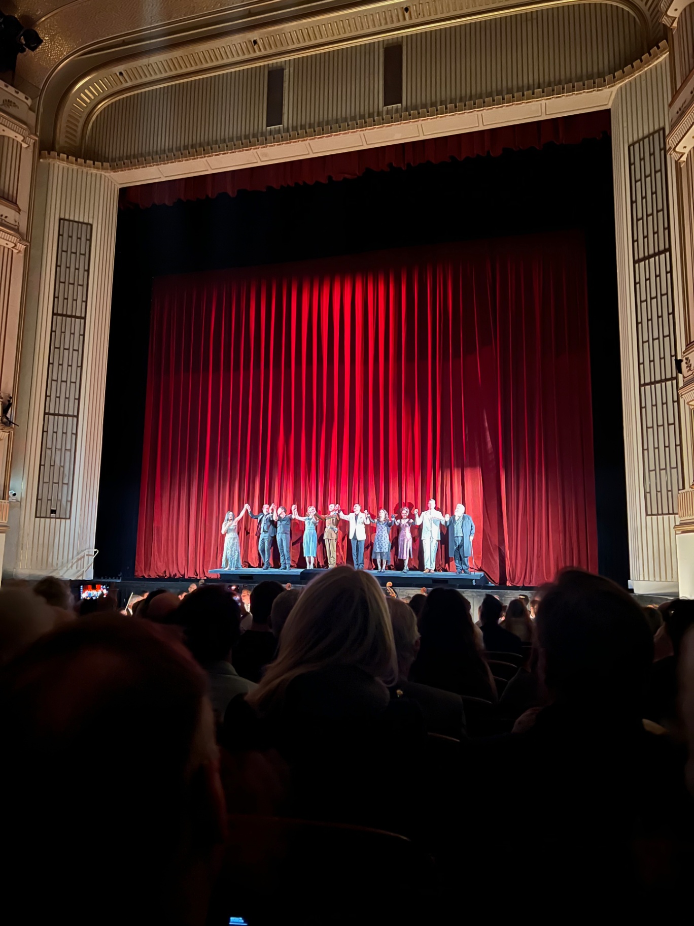 Vienna — Curtain call under the red velvet at the opera.