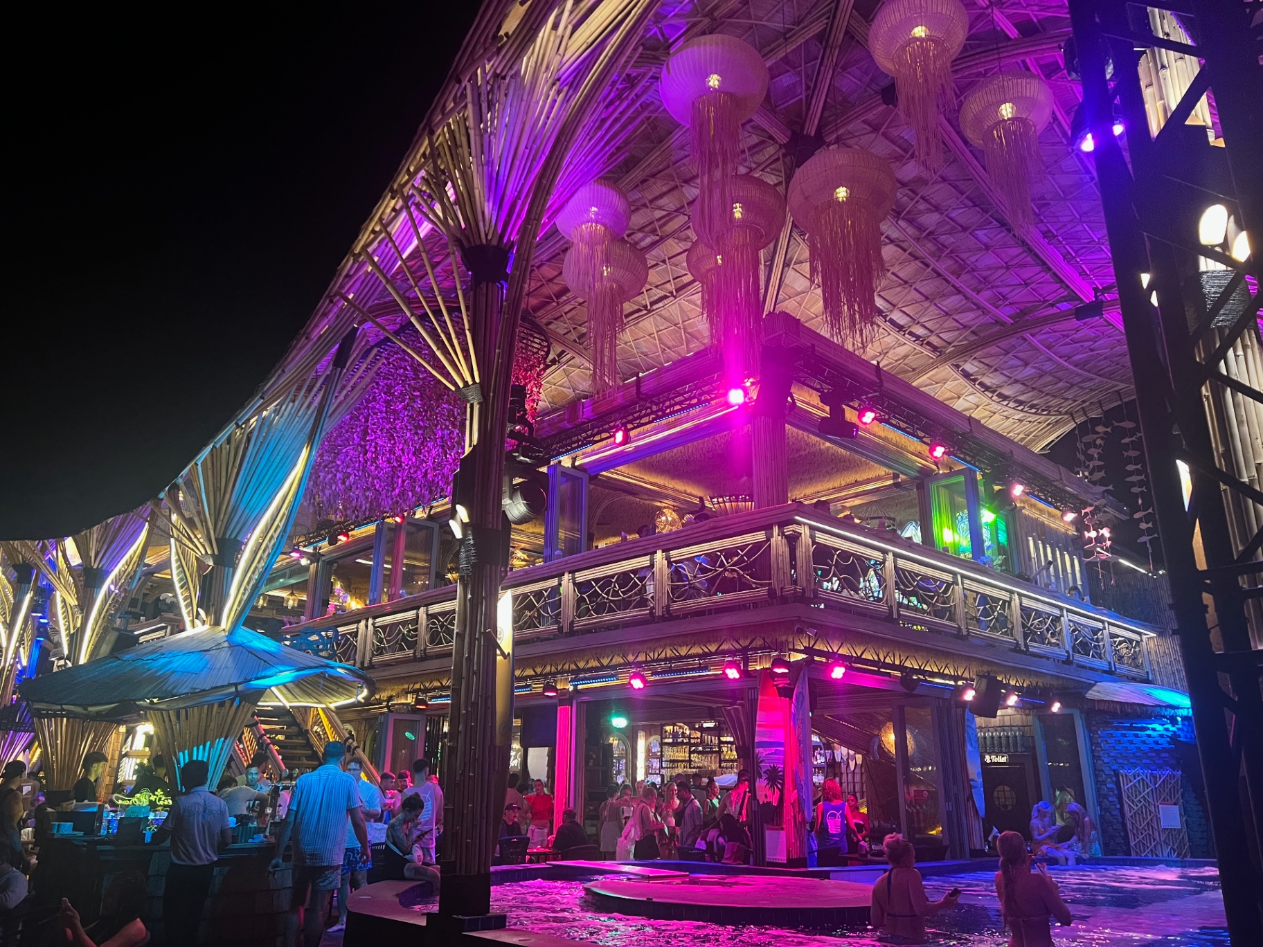 Krabi — A neon-soaked night scene at one of Krabi’s open-air venues.