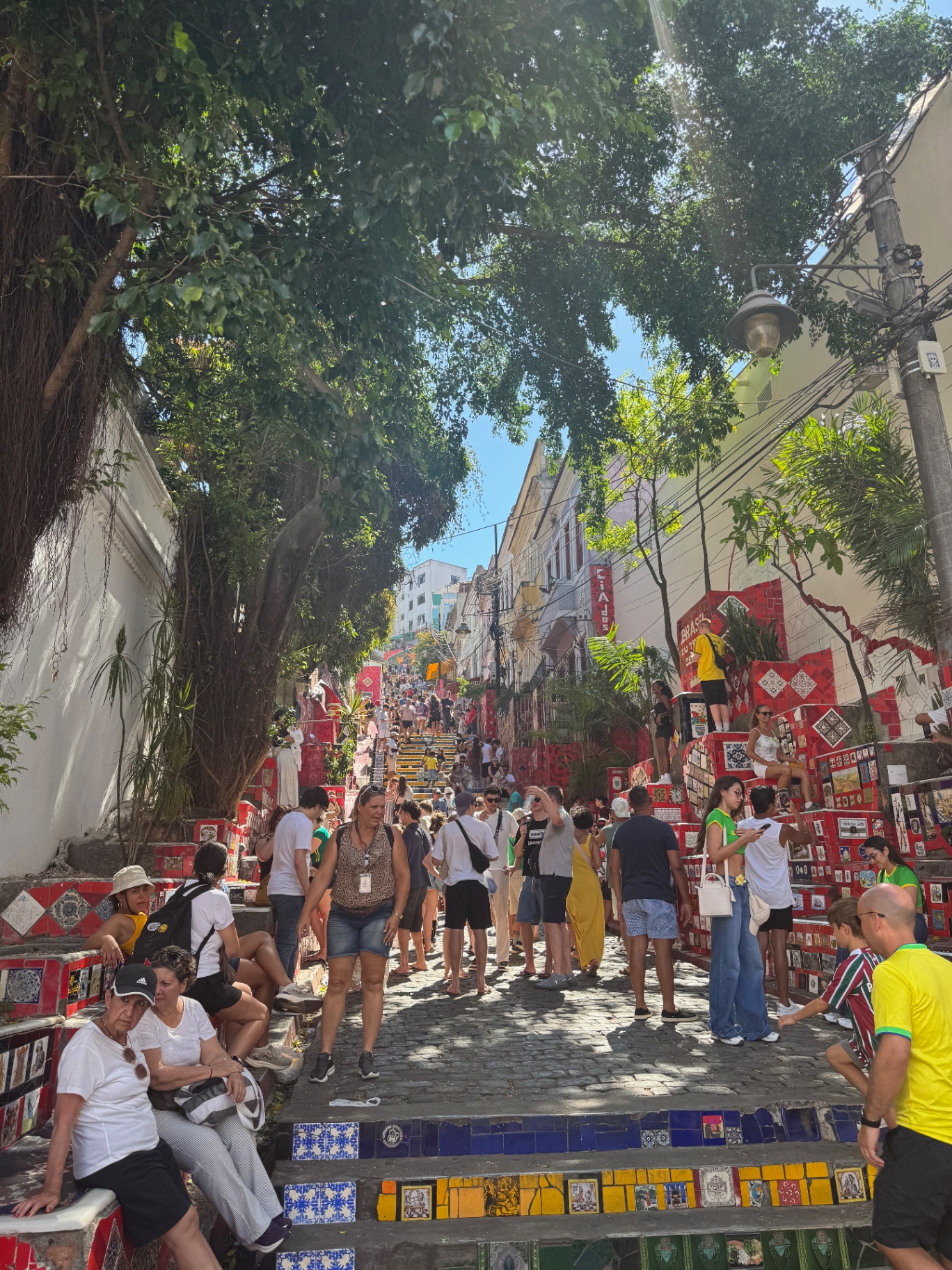 Rio de Janeiro — Escadaria Selarón packed under the canopy of trees.