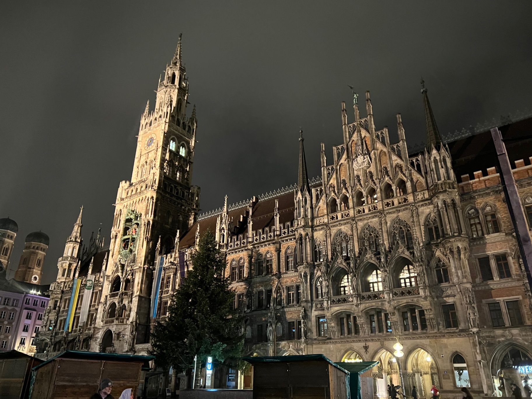 Munich — Neues Rathaus on Marienplatz, gothic spires under a night sky.