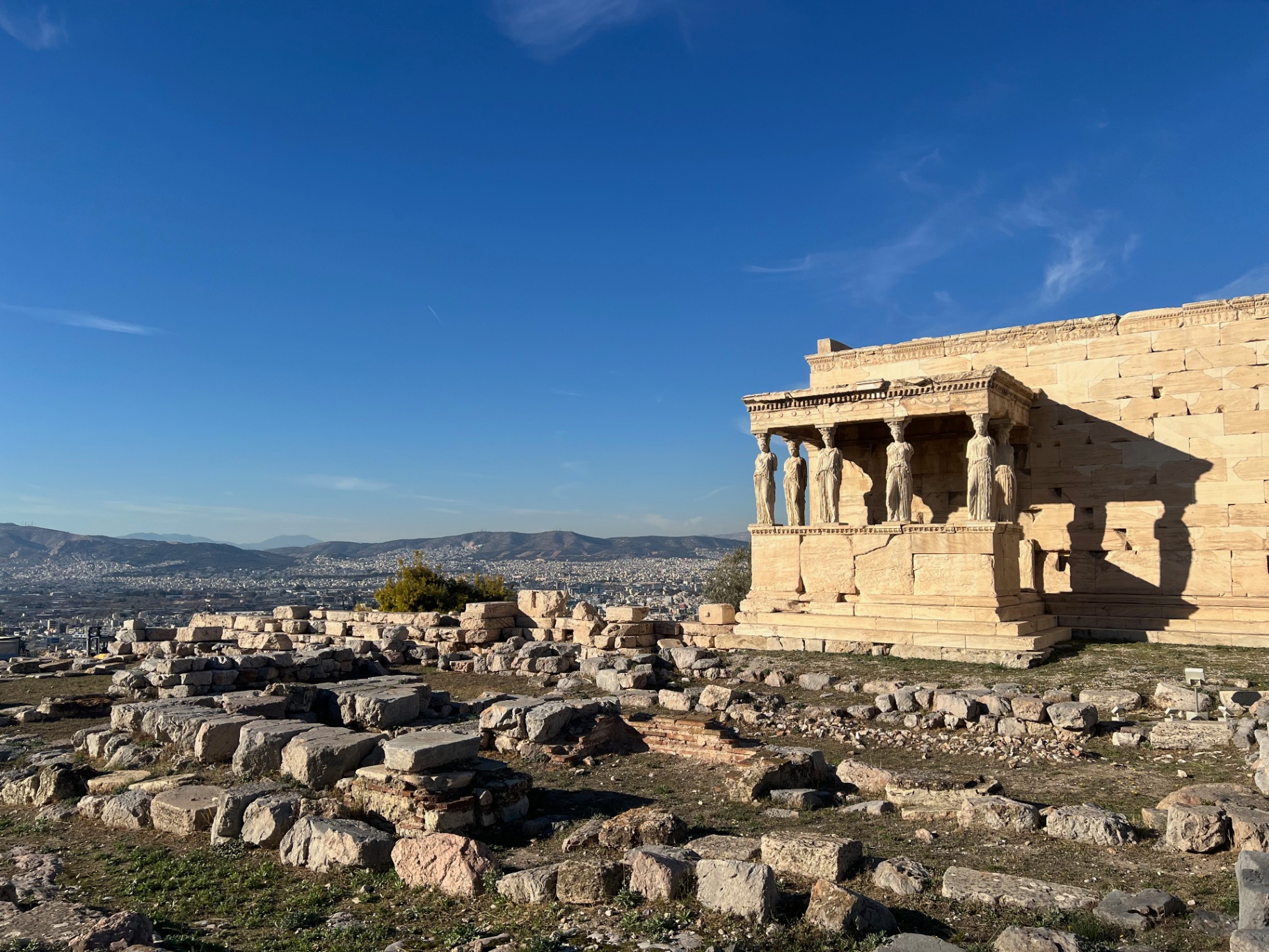 Athens — The Caryatids of the Erechtheion over the city.