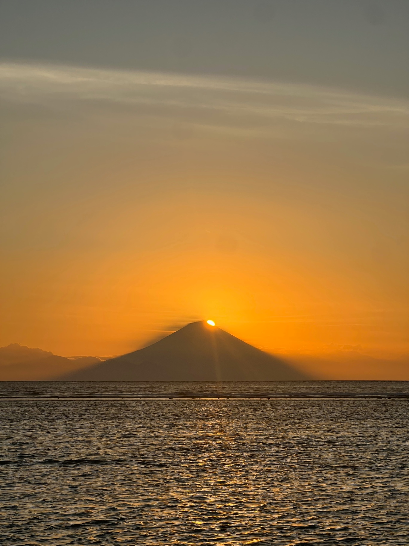 Gili Trawangan — Sun setting behind Mount Agung, seen from Gili Trawangan.