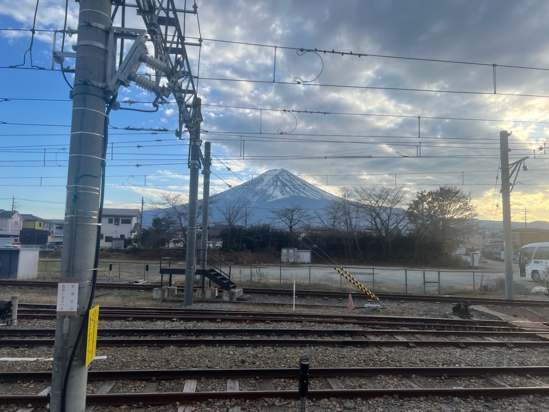 Mount Fuji — Mount Fuji peeking out from behind a tangle of train wires.