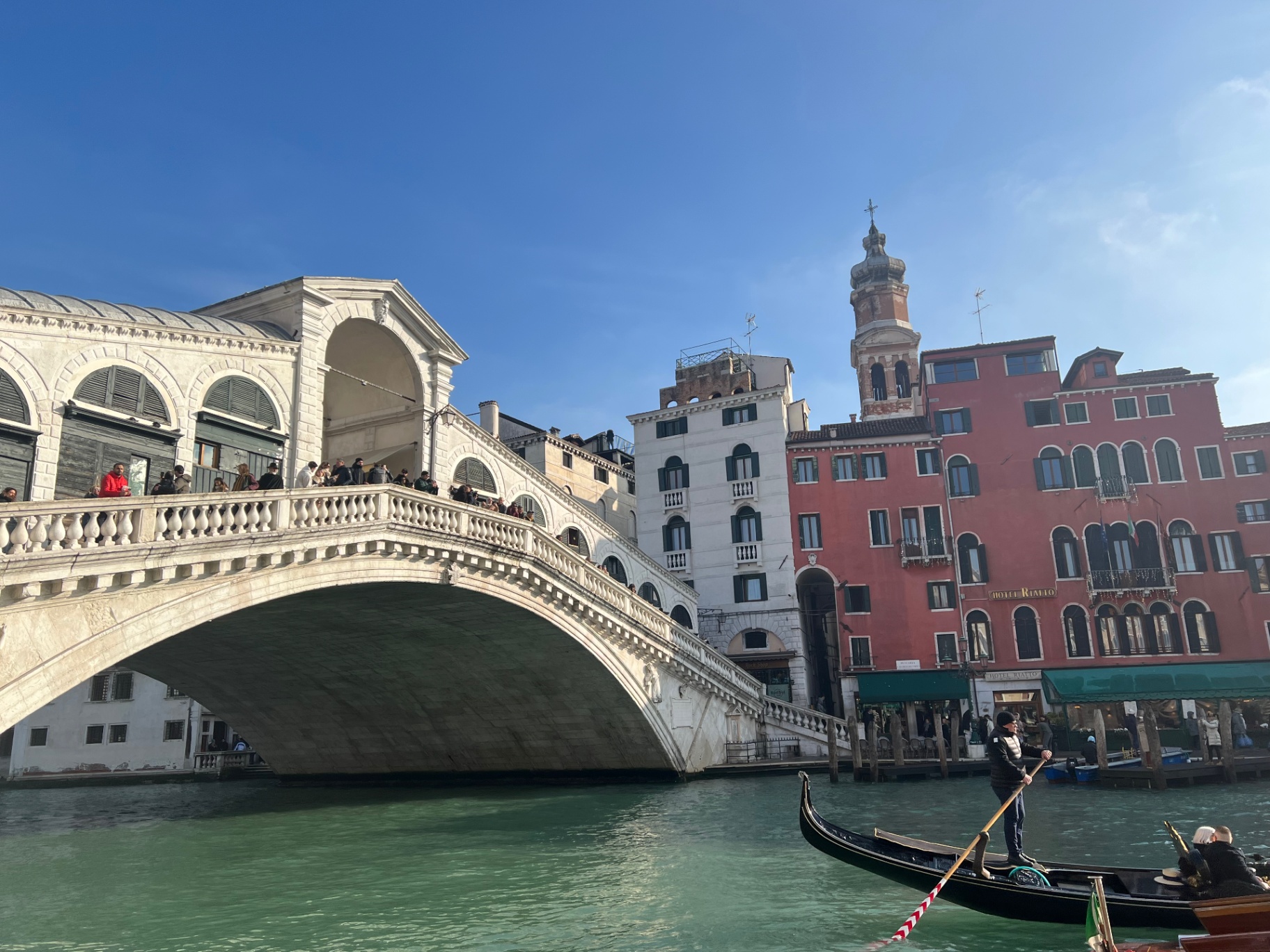 Venice — Gondolier passing under the Rialto Bridge.