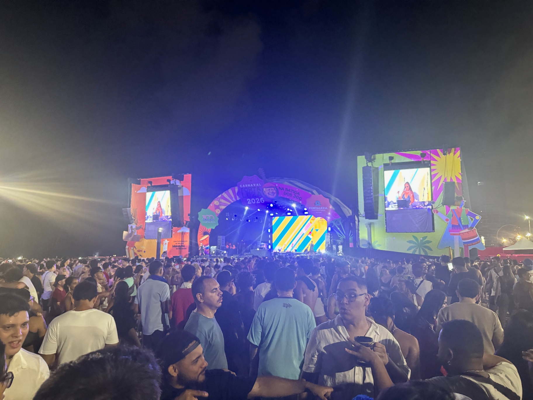 Fortaleza — Carnaval 2026 on the beachfront, stage lit in neon.