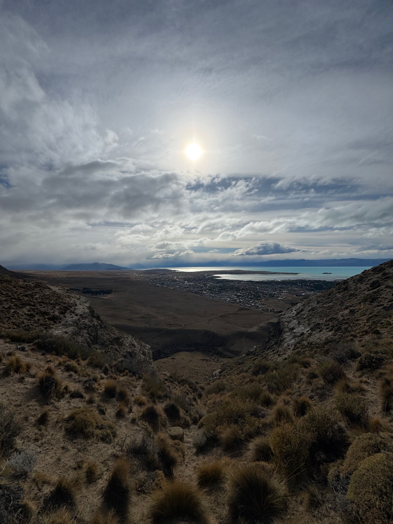 El Calafate — Sun breaking over the valley above town.