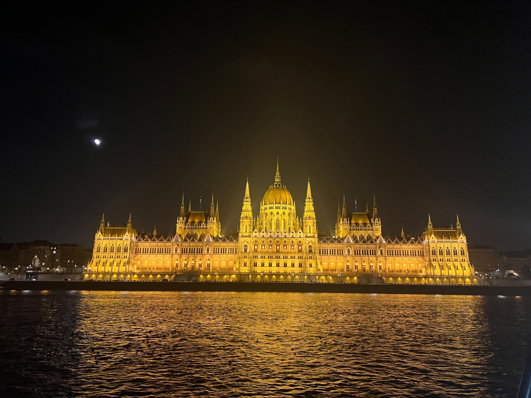 Budapest — The Hungarian Parliament glowing over the Danube.