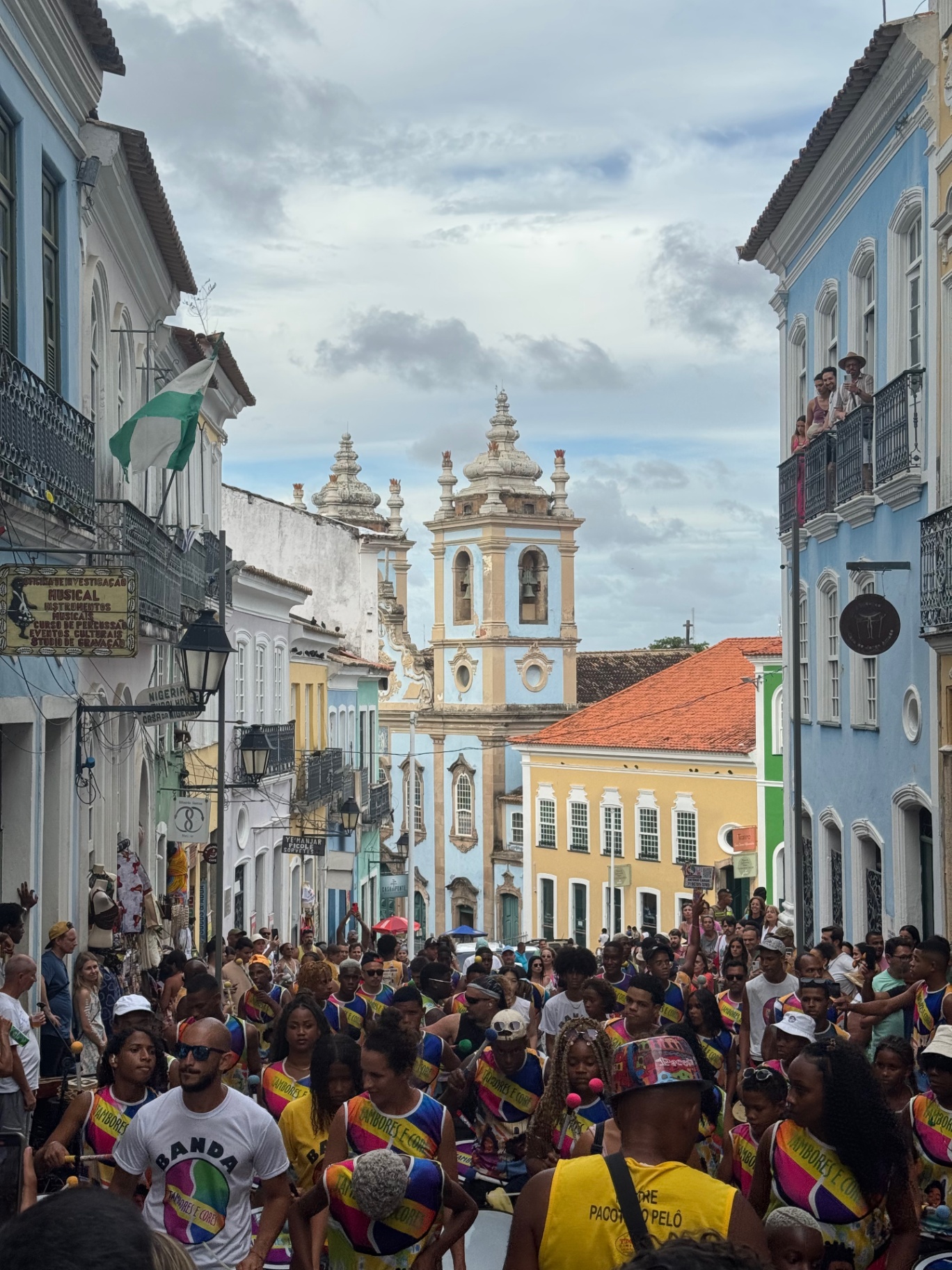 Salvador — Pelourinho packed with drummers beneath pastel façades.