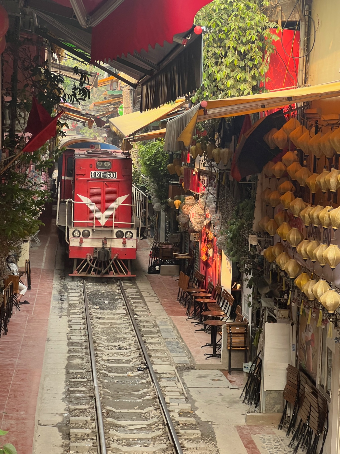 Hanoi — A train squeezing through Hanoi's famous Train Street.
