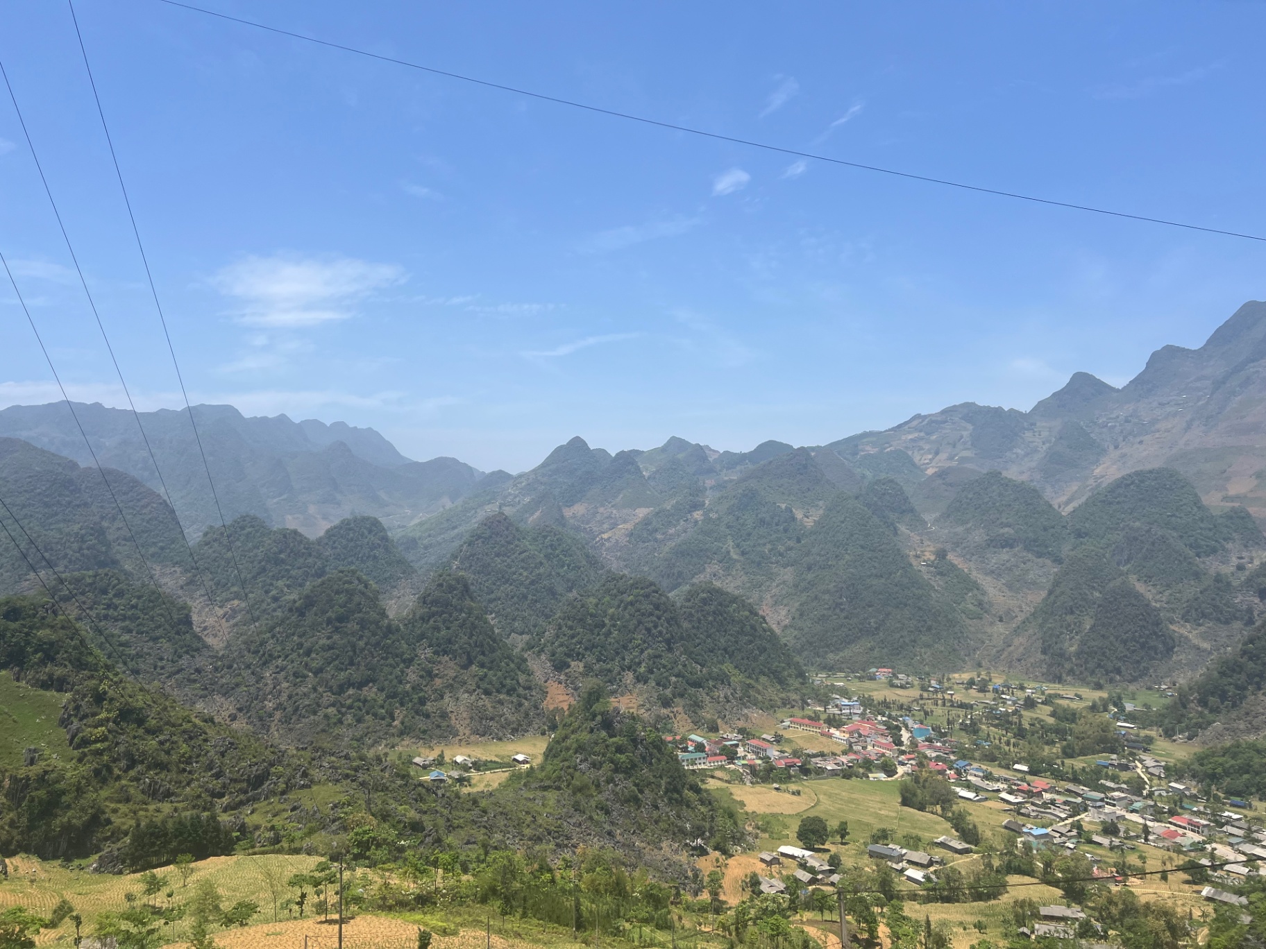 Ha Giang — Karst peaks stretching beyond a valley village.