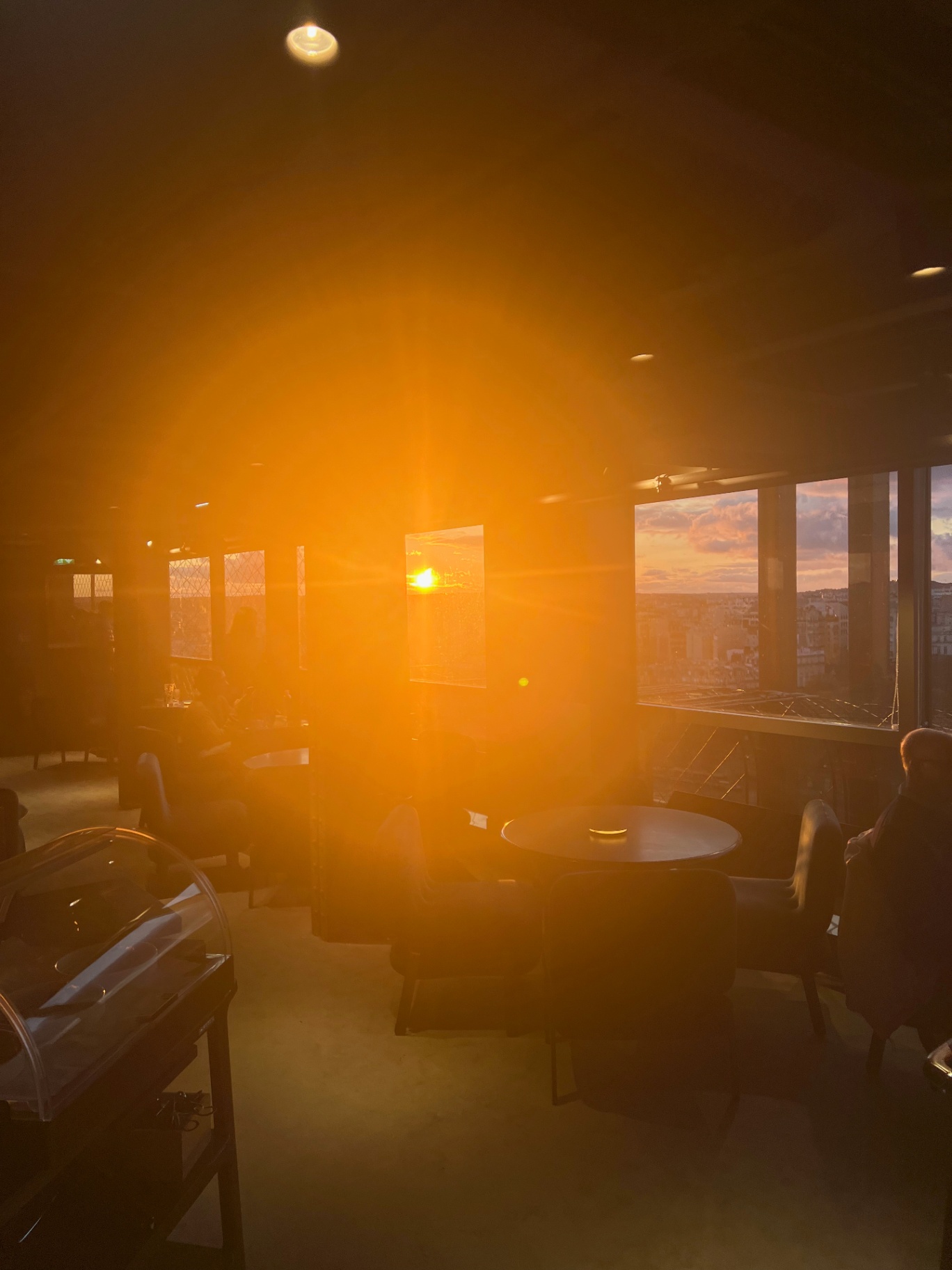 Paris — Sunset burning through the windows of Le Jules Verne.