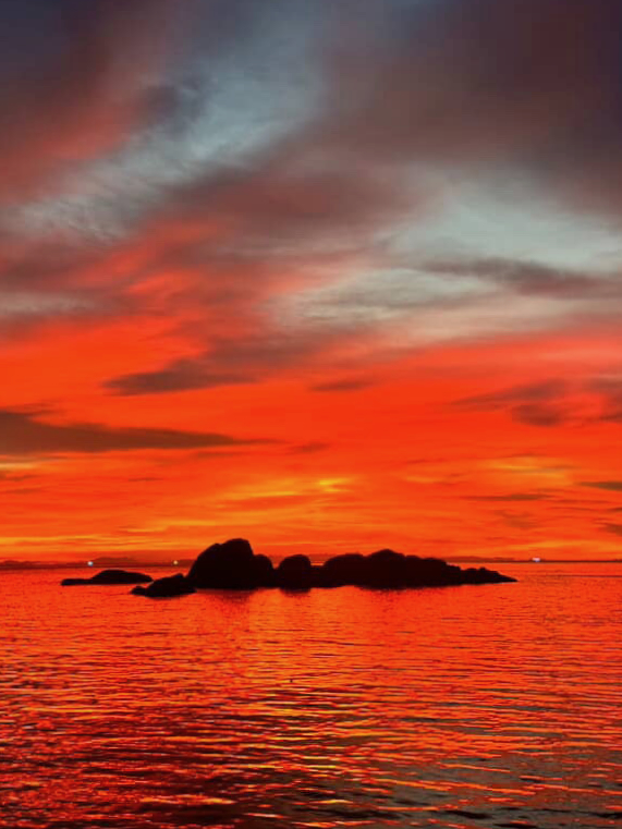 Ko Tao — Sky on fire over the rocks at last light.