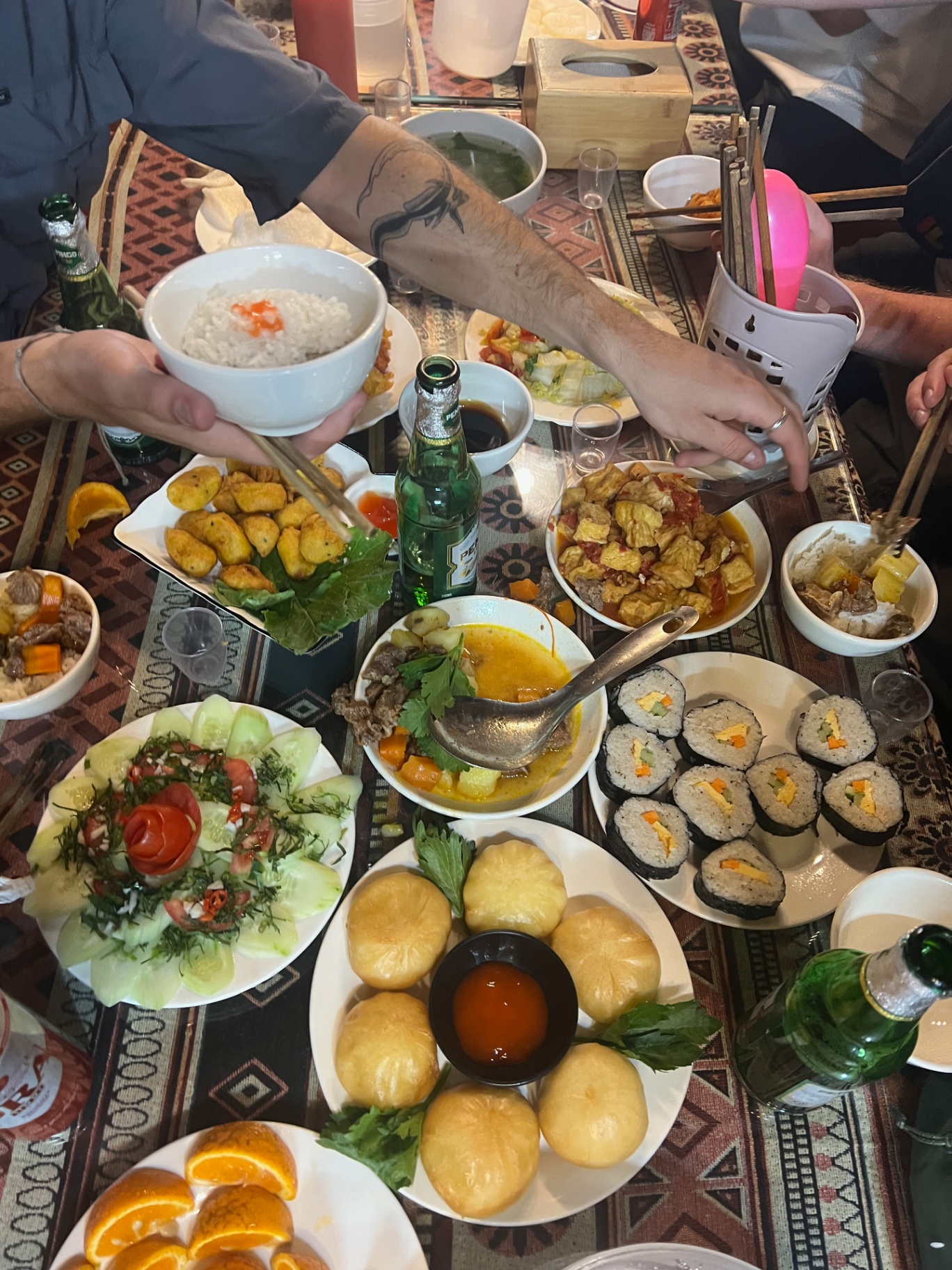 Ha Giang — Family-style feast at a homestay after a long day riding.