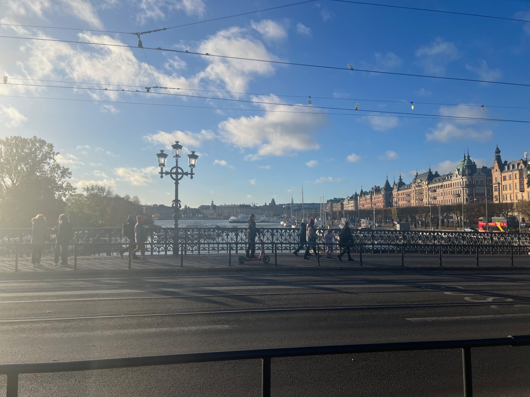 Stockholm — Crossing Djurgårdsbron under a bright Swedish sky.