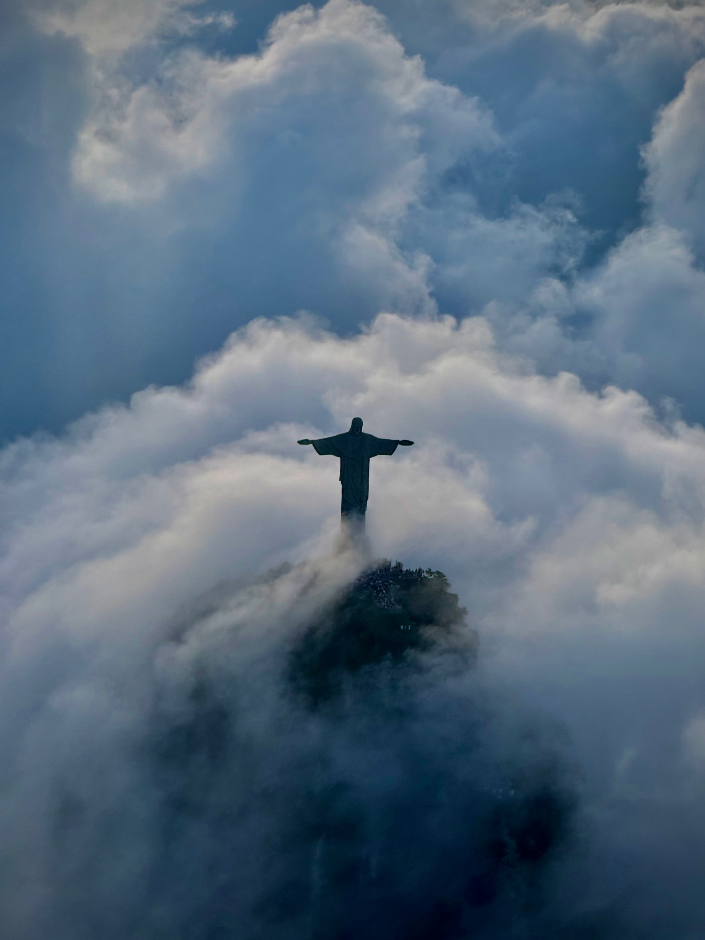 Rio de Janeiro — Cristo Redentor framed by towering cumulus.