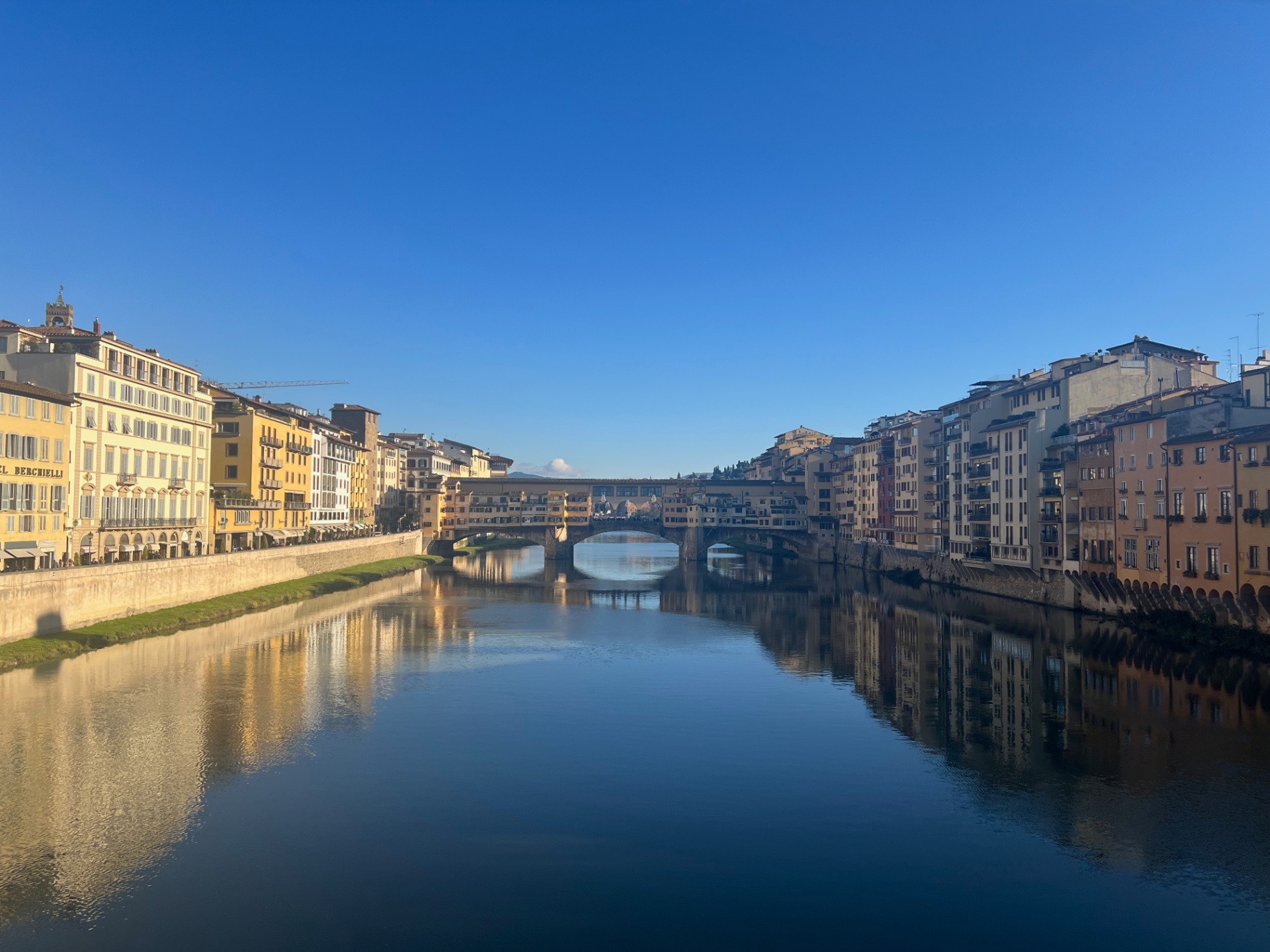 Florence — The Ponte Vecchio reflected in the Arno.