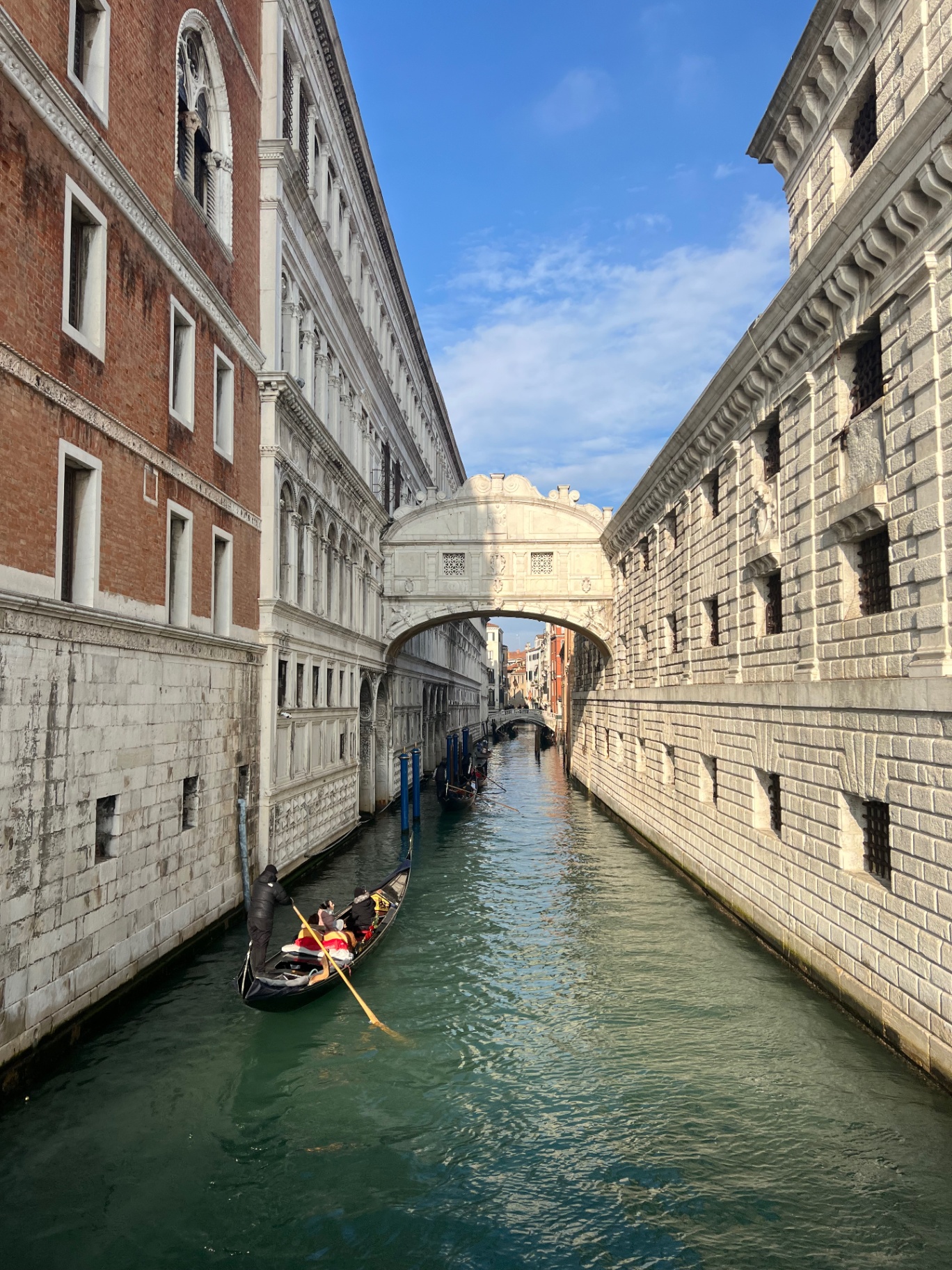 Venice — Gondola gliding under the Bridge of Sighs.