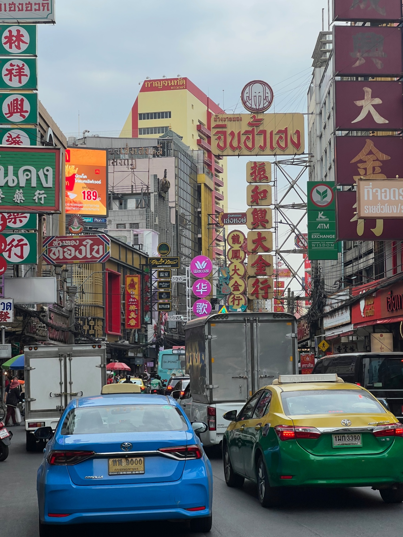 Bangkok — Chinatown traffic and a forest of Thai-Chinese signs.