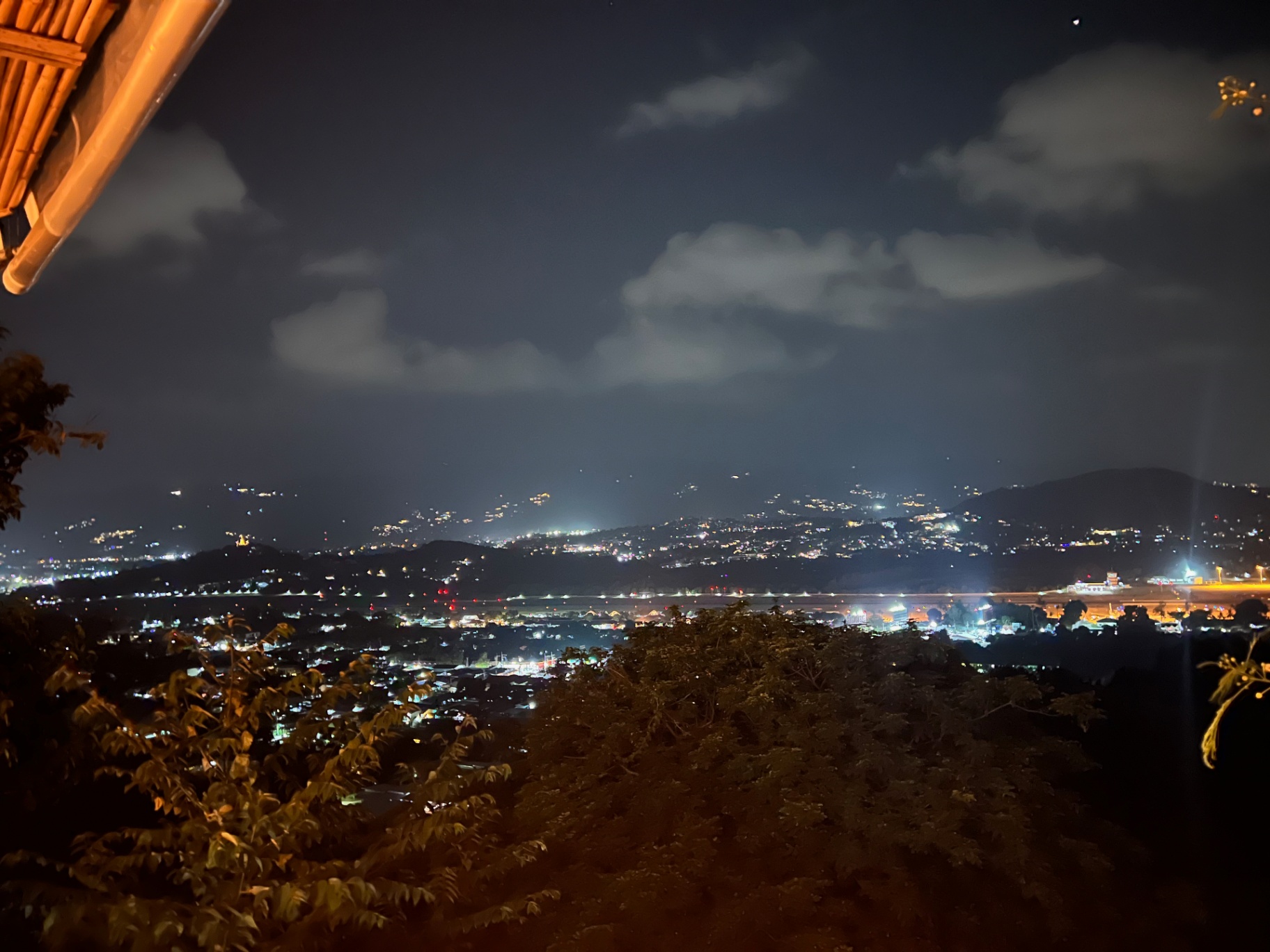 Ko Samui — Island lights twinkling across the valley after dark.