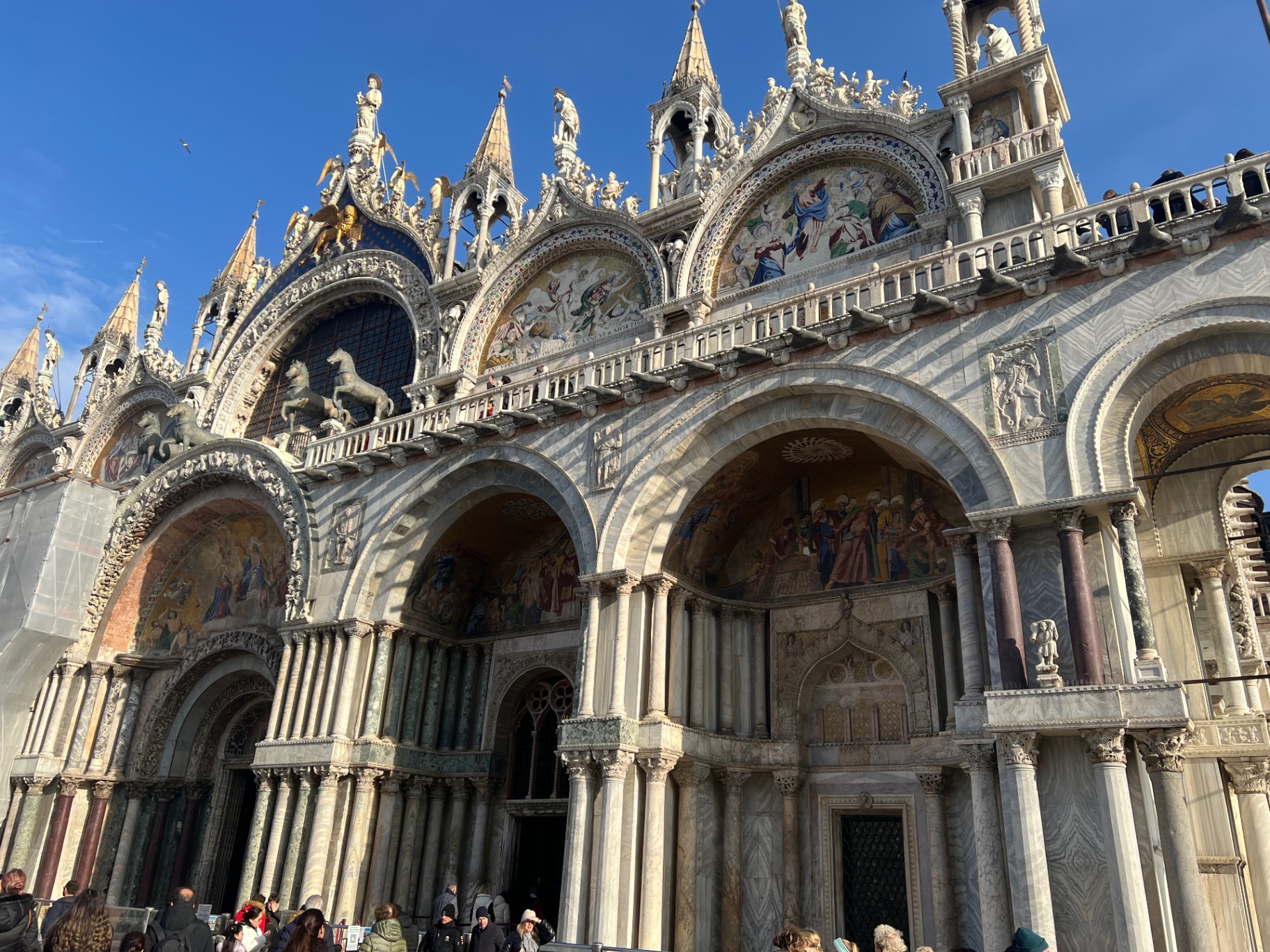 Venice — Mosaics and marble on the façade of St. Mark's Basilica.