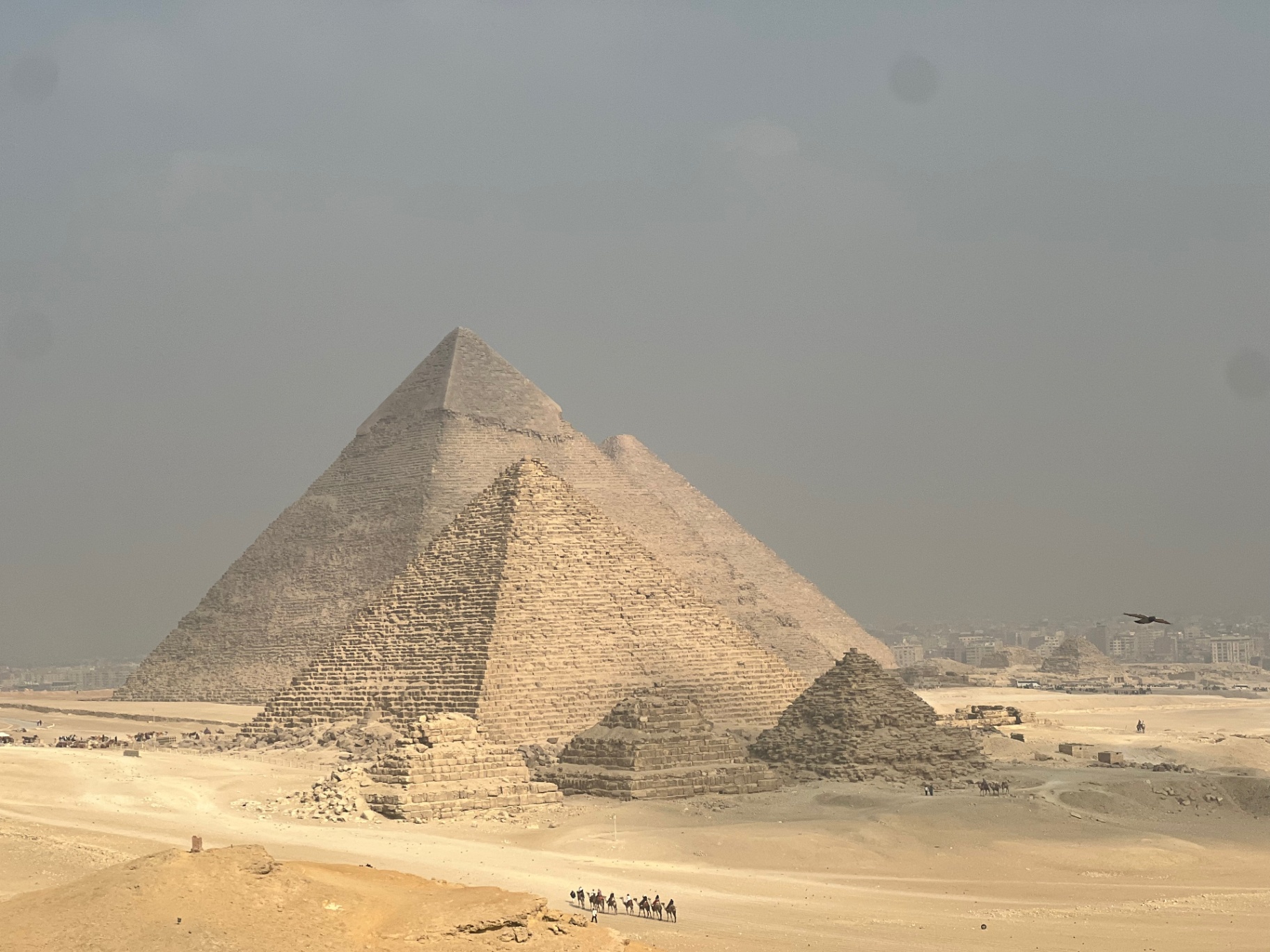 Cairo — The Great Pyramids stacked on the horizon.
