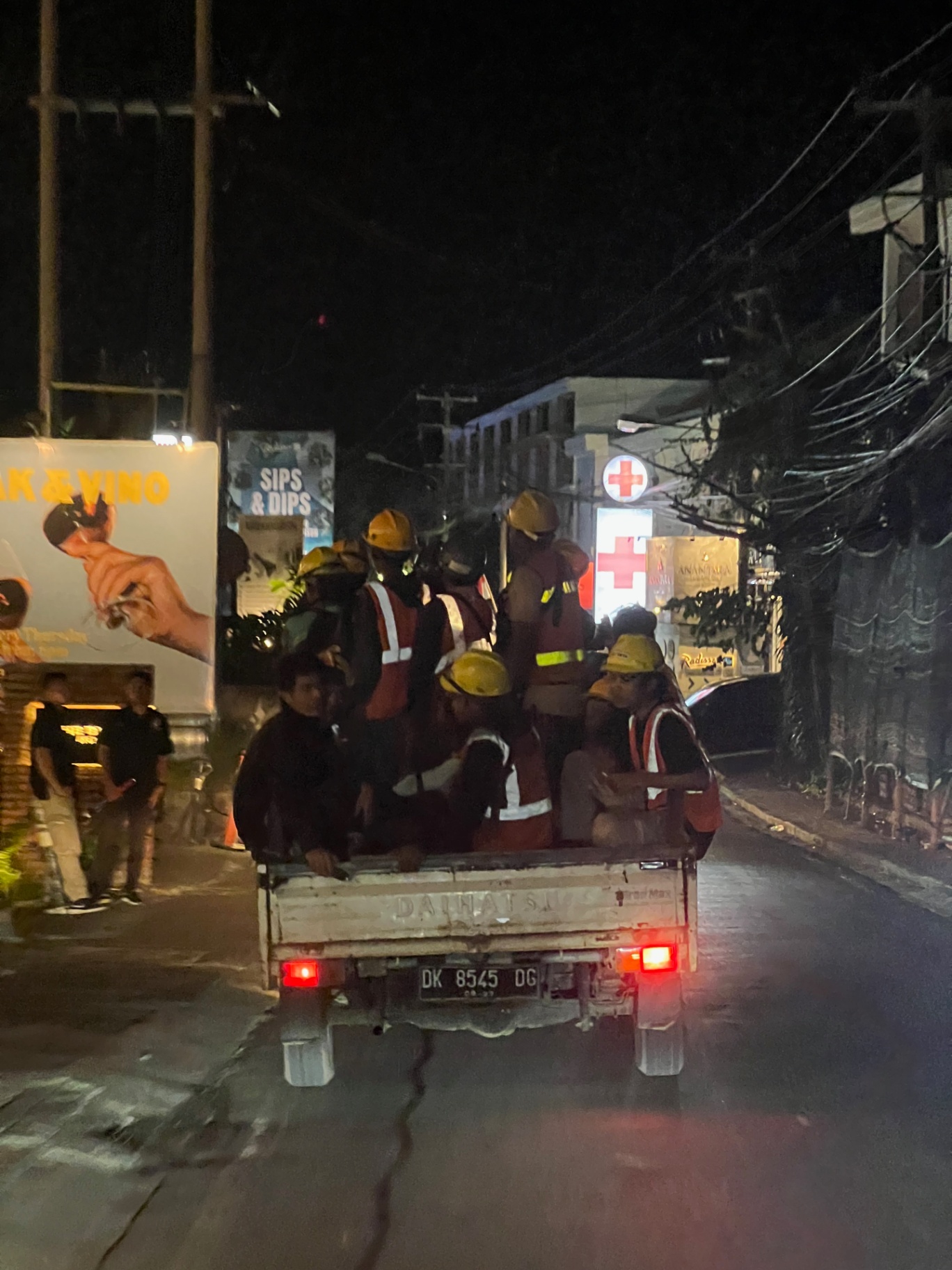 Bali — A pickup full of firefighters cruising the Canggu streets after dark.
