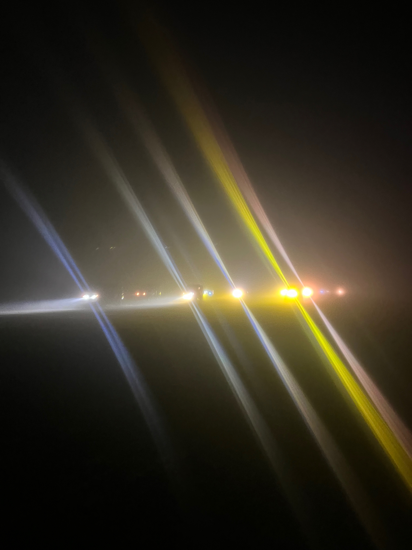 Mount Bromo — Jeep headlights cutting through the pre-dawn dark.